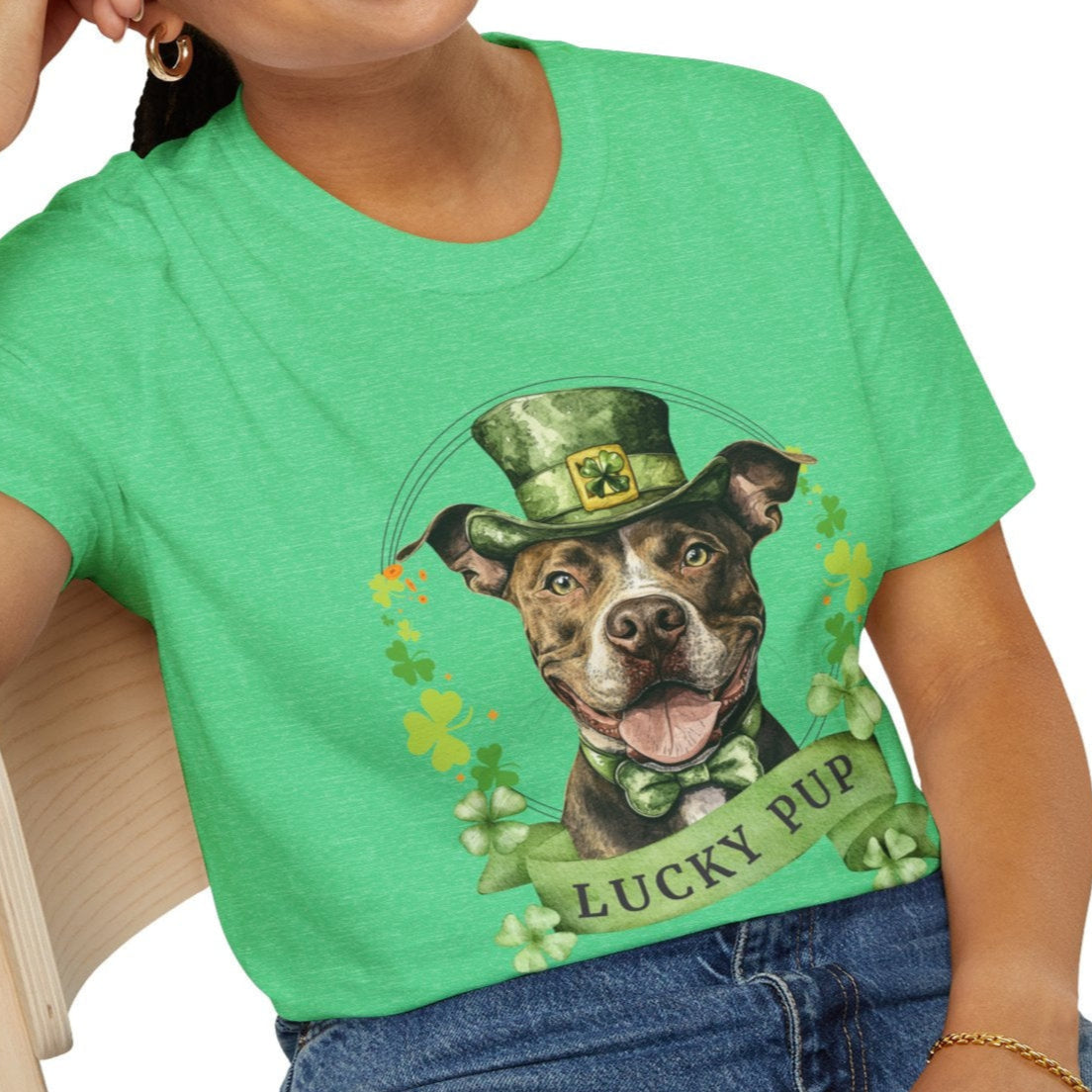 Person wearing a St. Patrick’s Day Pit Bull dog t-shirt with a lucky shamrock print, heather kelly green