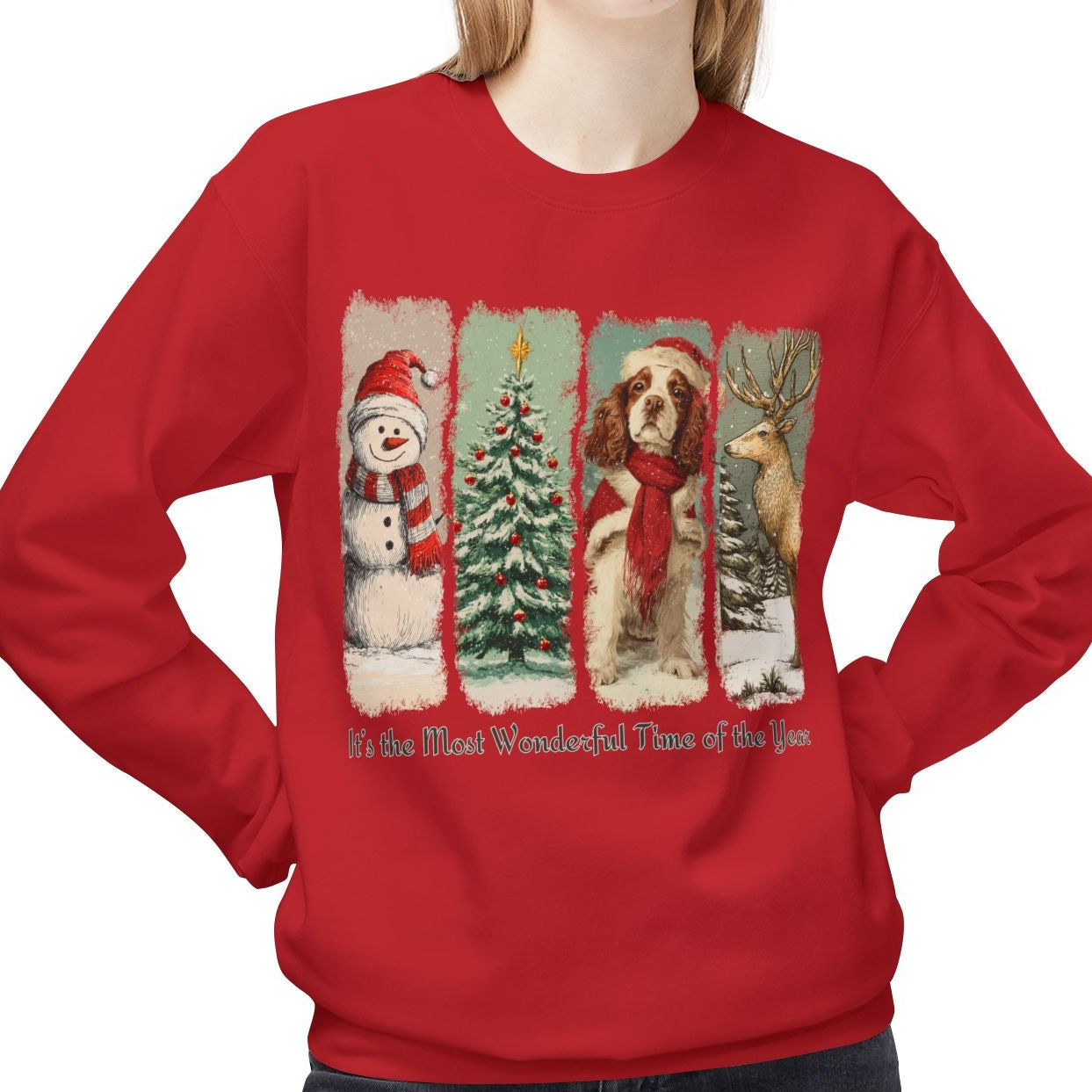 Person wearing a red Christmas-themed sweatshirt with a snowman, tree, and dog design.