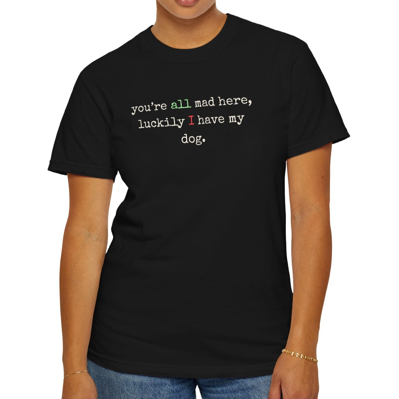 Person wearing a black t-shirt with text on a white background