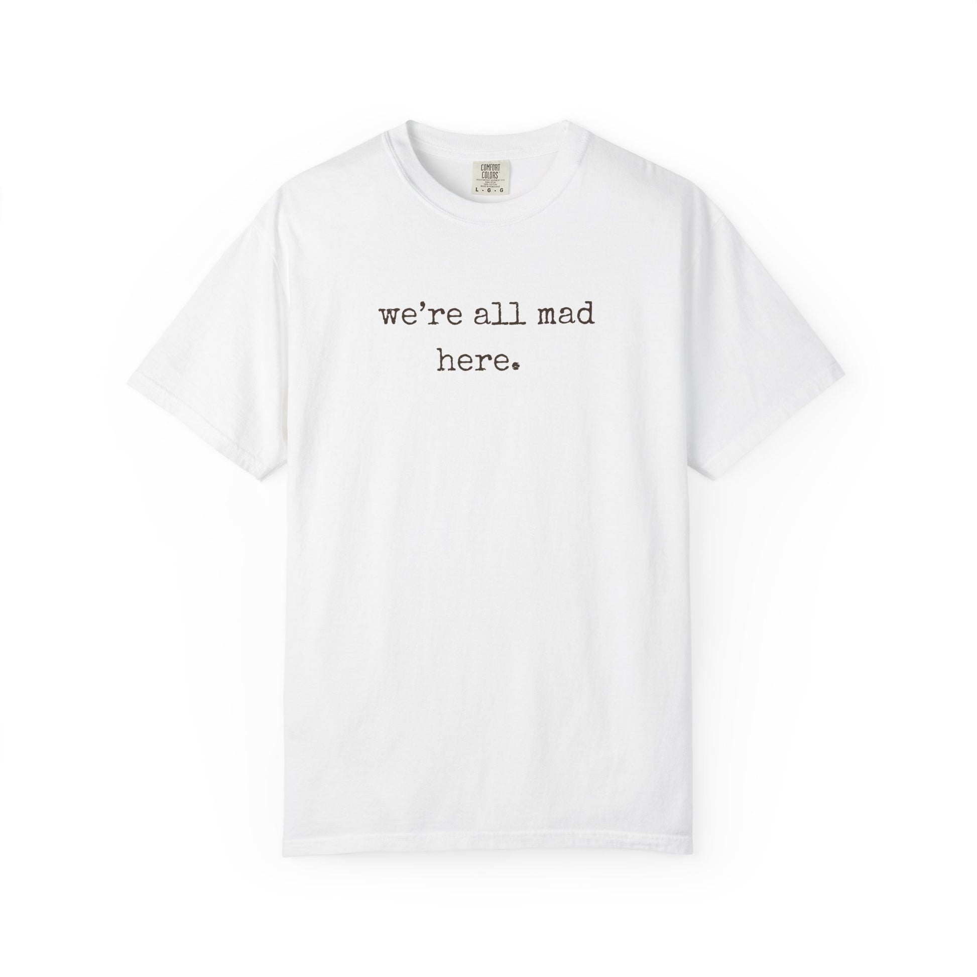 White t-shirt with 'we're all mad here.' text on a white background