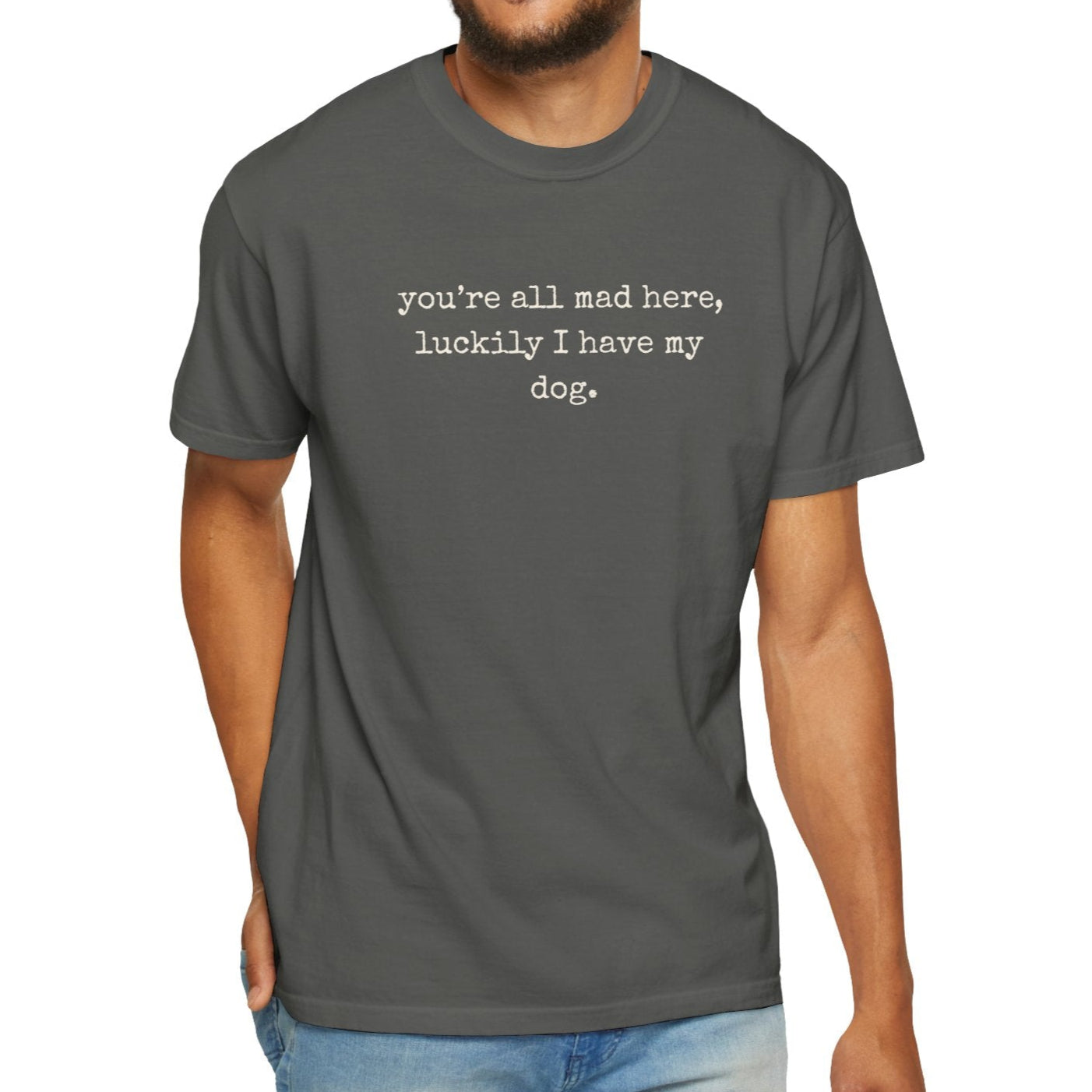 Man wearing a gray t-shirt with text on a white background