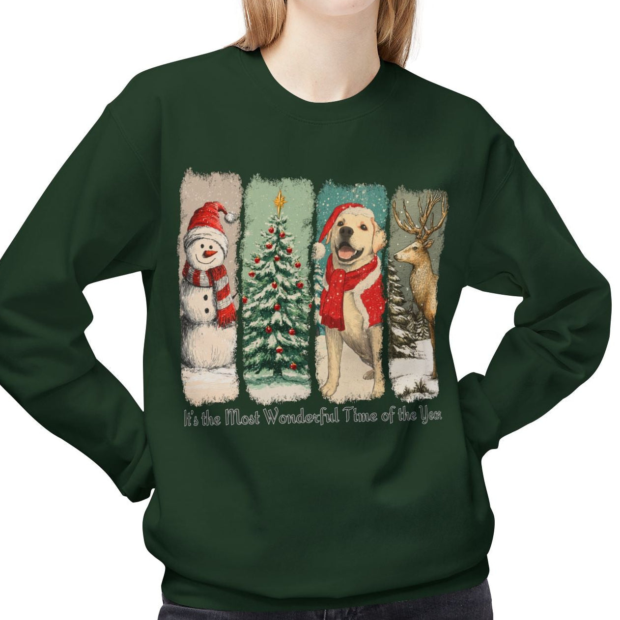 Person wearing a green sweatshirt with Christmas-themed design featuring a snowman, tree, and dog.