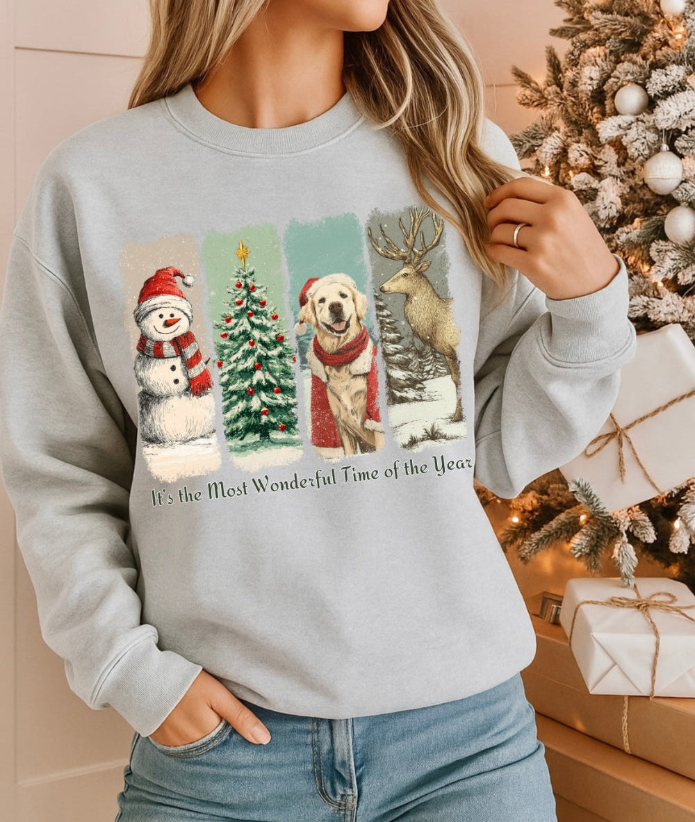 Person wearing a Christmas-themed sweatshirt with festive graphics in front of a decorated Christmas tree.