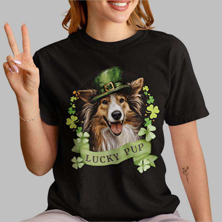 Woman in black St. Patrick’s Day t-shirt featuring a Sheltie dog with a shamrock garland and festive Irish design