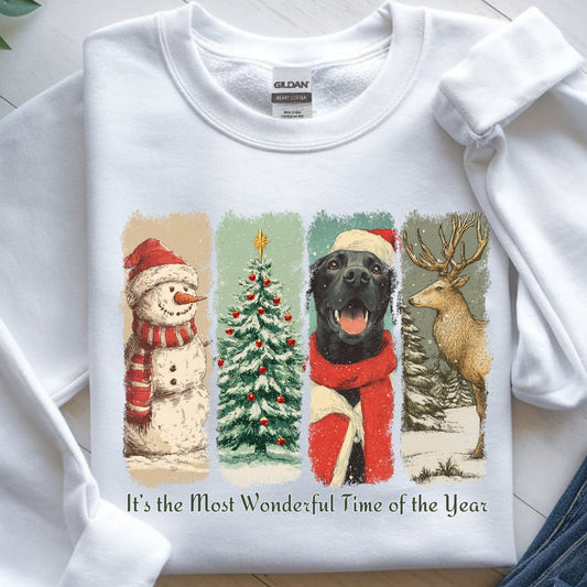 White sweatshirt with Christmas-themed design featuring a dog, snowman, tree, and reindeer on a white background.