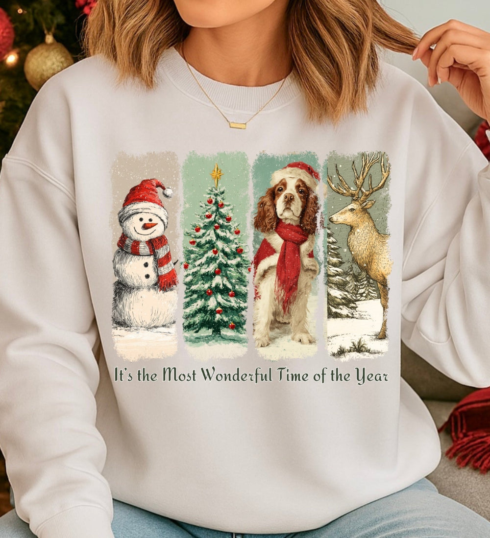 Person wearing a white sweatshirt with Christmas-themed designs and text.