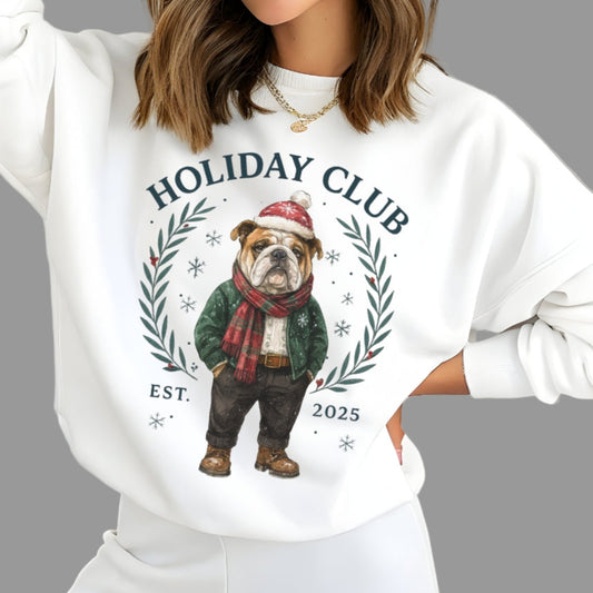 Woman wearing a white sweatshirt with a holiday-themed design featuring a dog and text.
