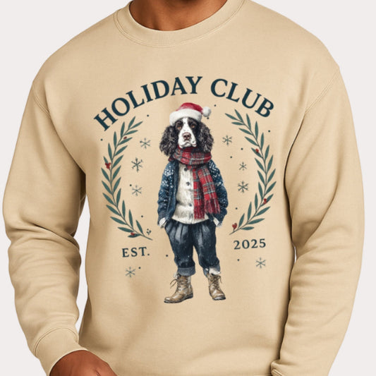 Beige sweatshirt with 'Holiday Club' design featuring a dog, on a white background.
