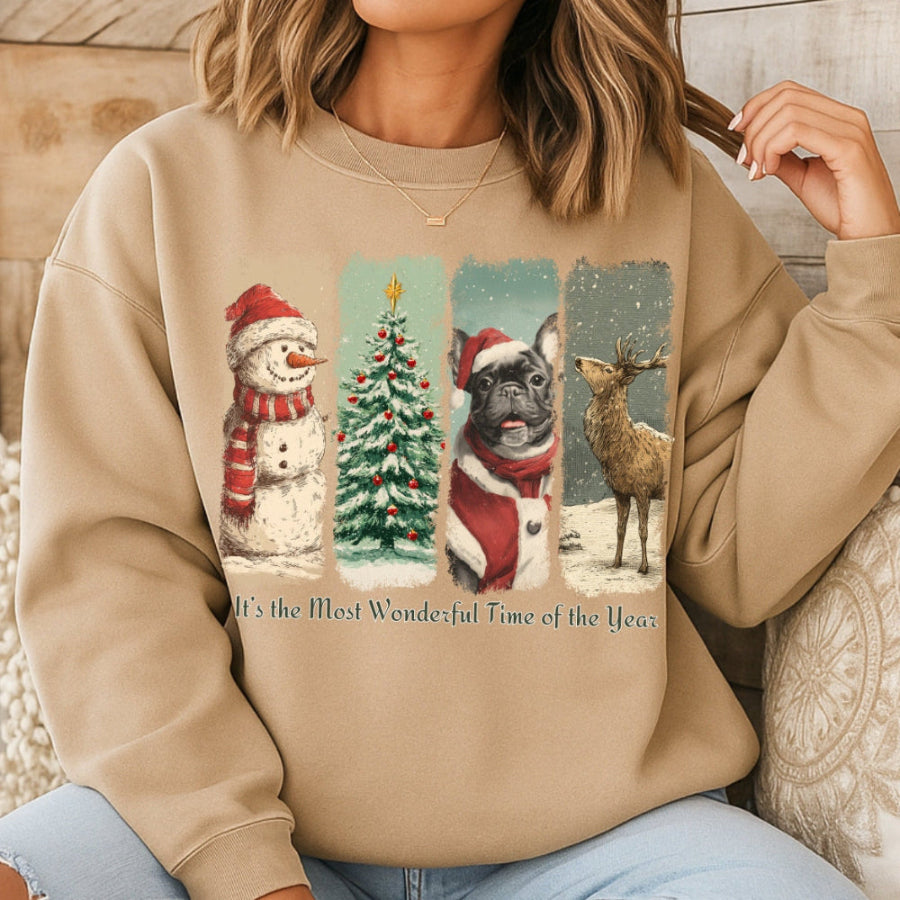 Person wearing a beige sweatshirt with Christmas-themed graphics and text.