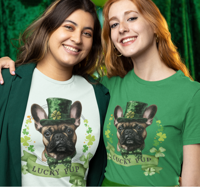 two women wearing St. Patrick’s Day t-shirt featuring a fawn french bulldog with a shamrock garland and festive Irish design