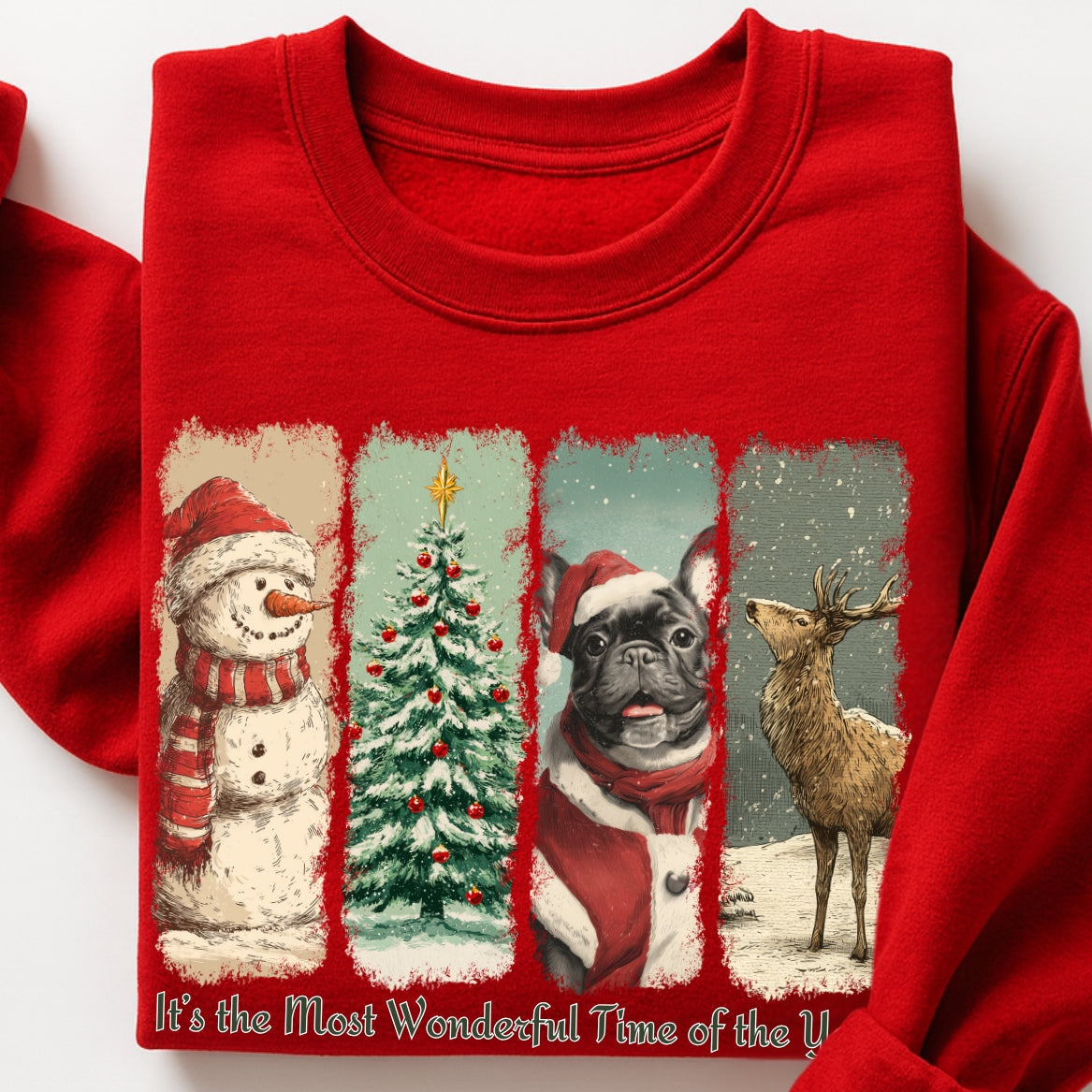 Red sweatshirt with Christmas-themed design featuring a snowman, tree, dog, and deer on a white background.