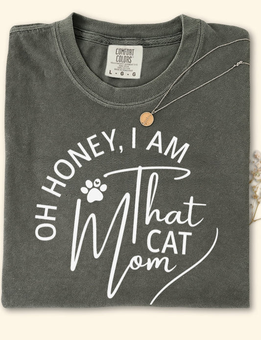 Gray t-shirt with 'Oh Honey, I am that cat mom' text on a white background