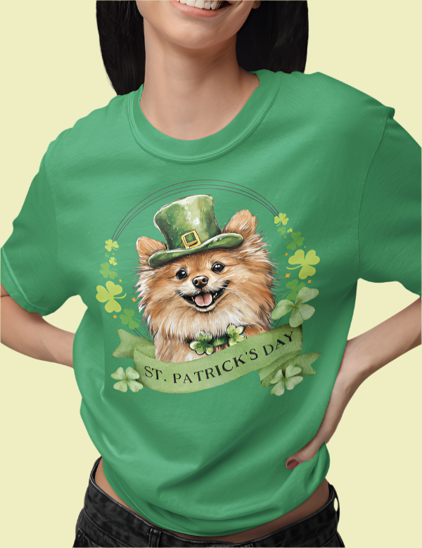 Woman in a St. Patrick’s Day t-shirt featuring a Pomeranian dog with a shamrock garland and festive Irish design