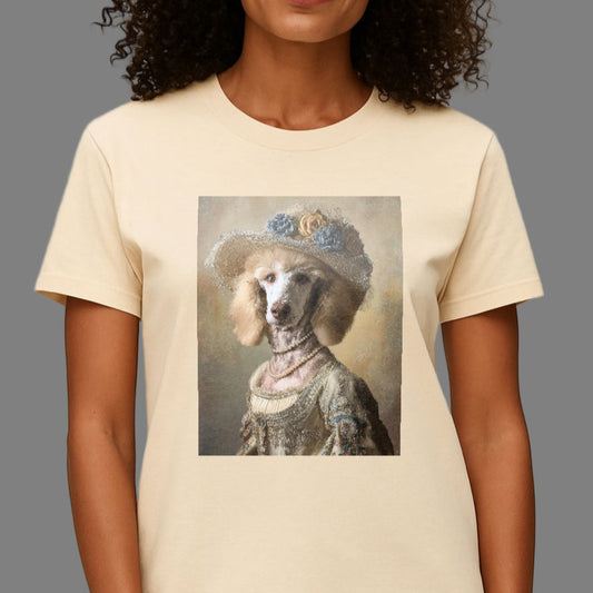Person wearing a cream t-shirt with a dog in a hat graphic on a plain background