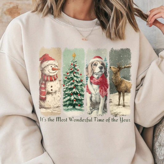 Person wearing a beige sweatshirt with Christmas-themed graphics and text.