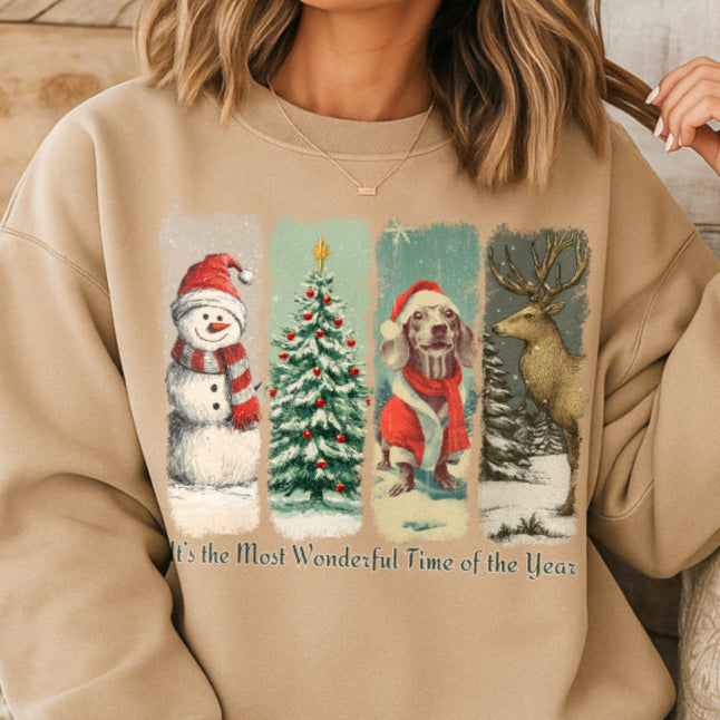 Person wearing a sand sweatshirt with Christmas-themed graphics and text.