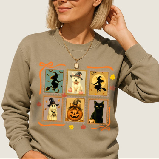 Person wearing a beige sweatshirt with Halloween-themed design on a plain background