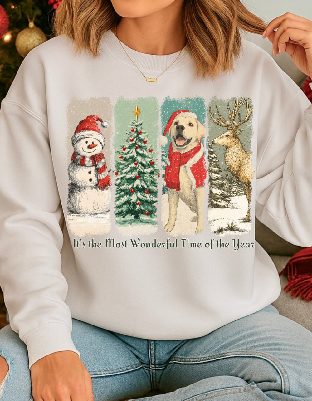 Person wearing a white sweatshirt with Christmas-themed designs and text.