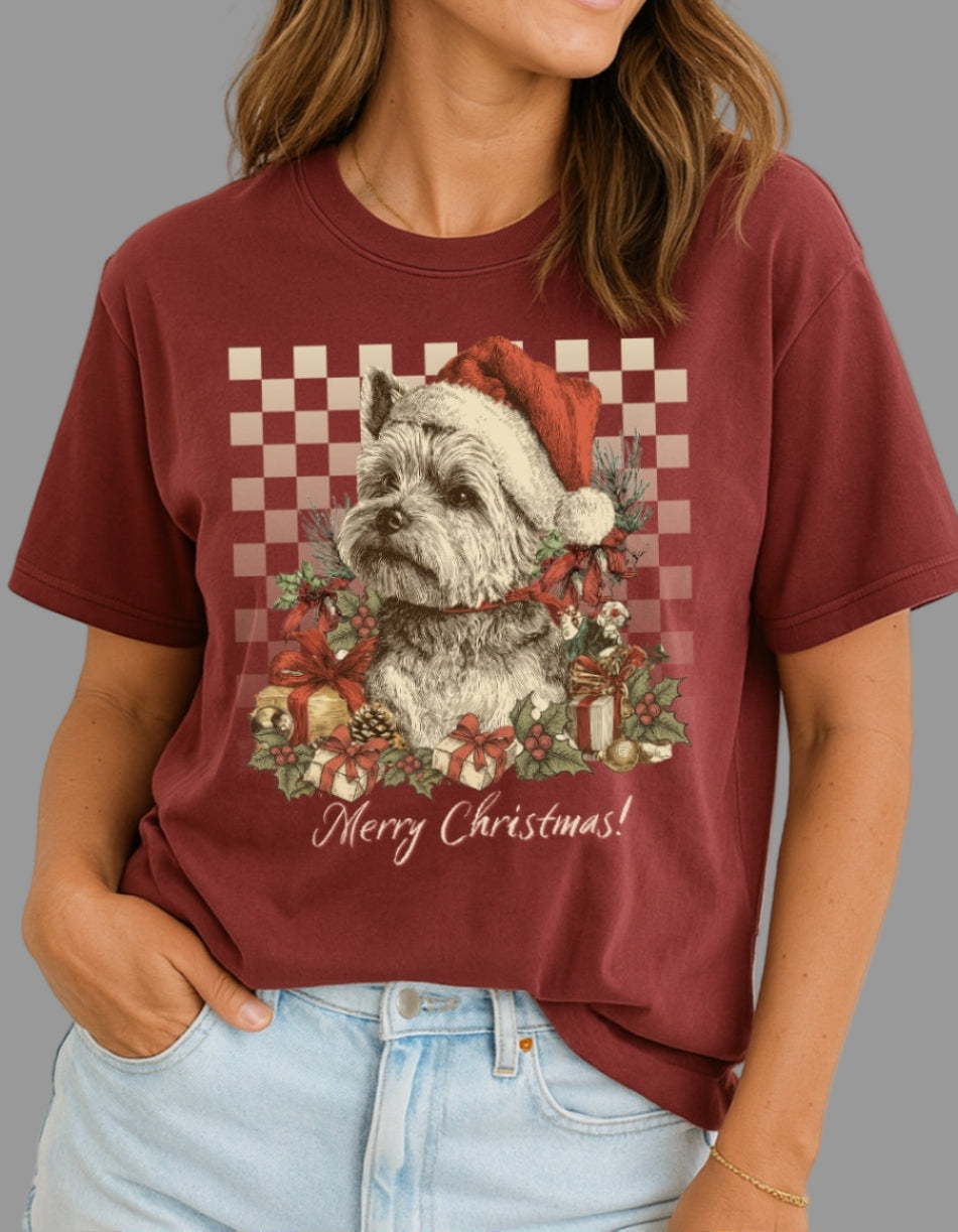 Woman wearing a maroon t-shirt with a Christmas-themed graphic of a dog and wreath.