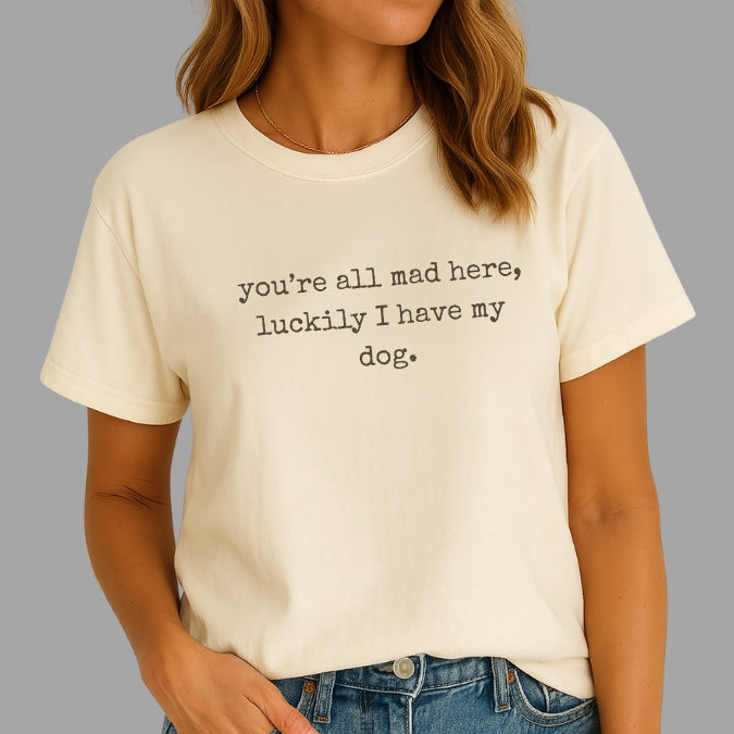Person wearing a white t-shirt with text on a gray background